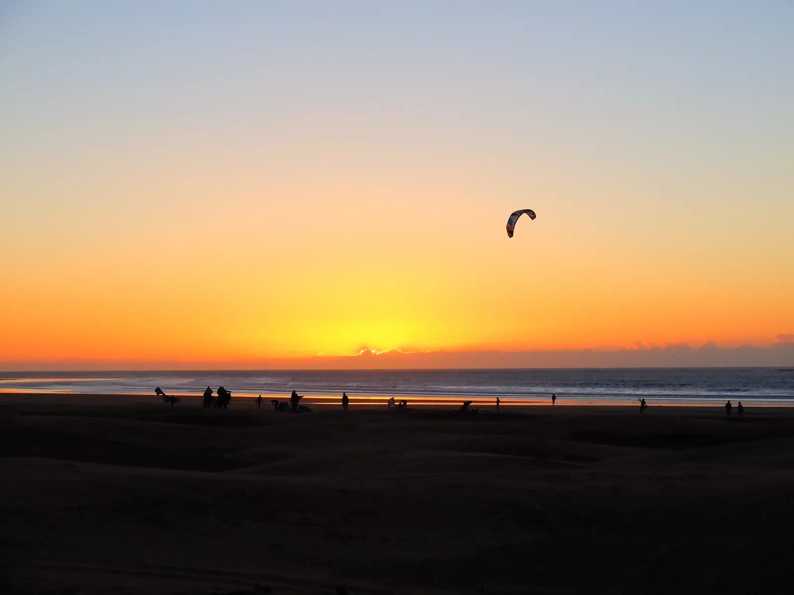 A kite against the setting sun on Essaouira beach