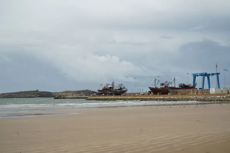 Essaouira’s long beach at low tide, the medina in the distance